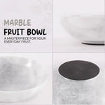 White marble fruit bowl shown from the side, from above and underneath, showing the veined stone and finished base