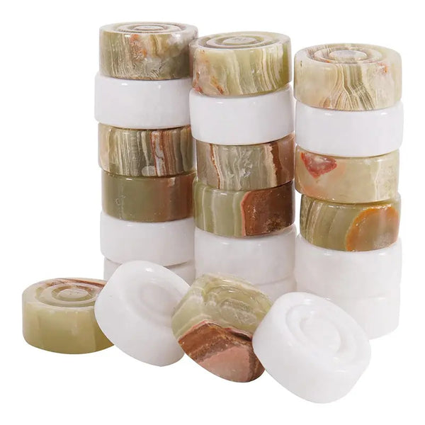 White marble and green onyx marble checkers pieces stacked — showing stackable natural stone disc construction by RADICALn