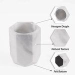 White marble wine chiller details: hexagon design, veined natural texture and felt bottom
