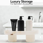 White onyx footed marble tray holding pump bottles as bathroom storage by a sink
