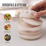 White onyx marble salt cellar with the lid lifted, shown as a versatile keeper for candies, dry fruits and spices